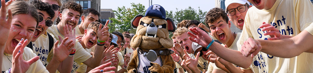 Students cheering with the Butler mascot
